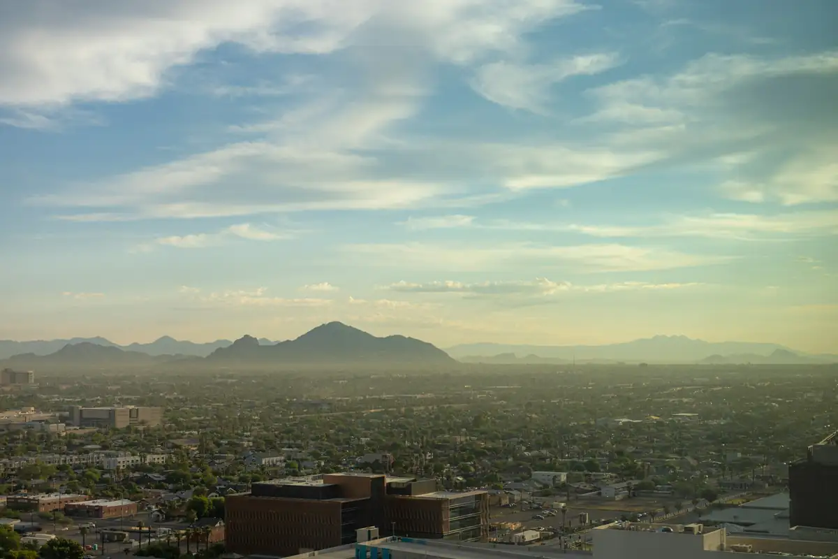 Sunrise over the Phoenix valley from downtown Phoenix, with Camelback Mountain in the distance